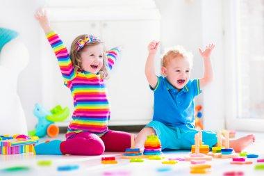 Depositphotos 72476397 stock photo children playing with wooden toys